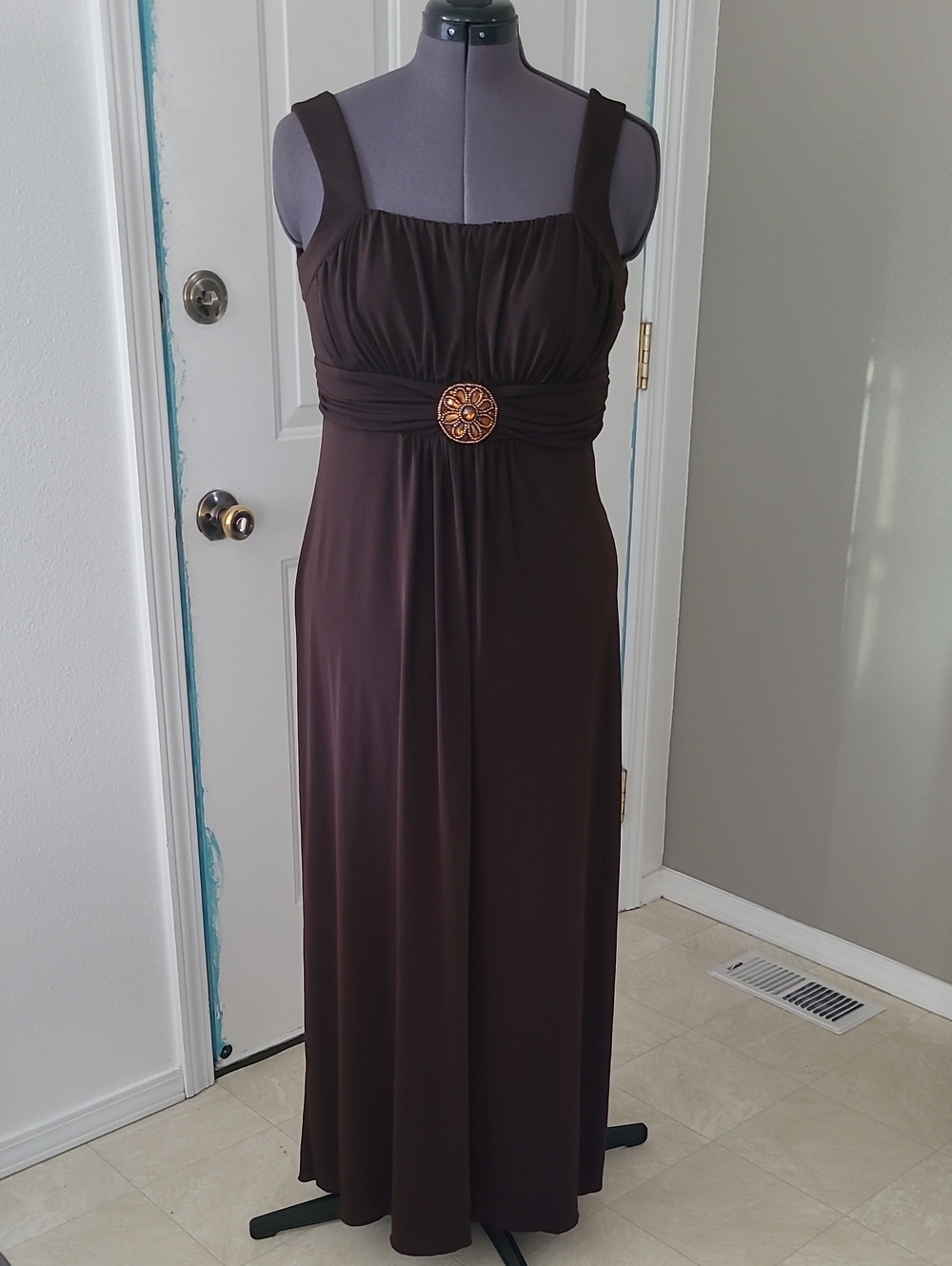 Enfocus Studio Dark Brown Empire Waist Maxi Dress with Decorative Medallion